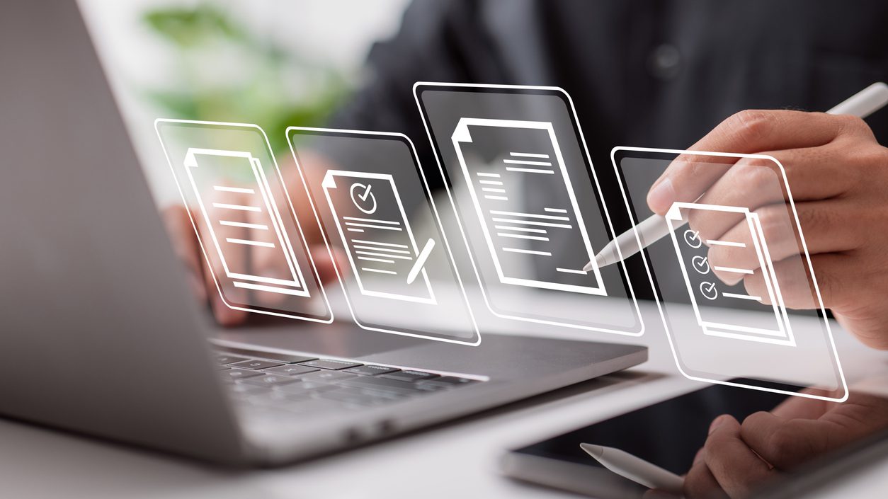 Paperless workplace idea, e-signing, electronic signature, document management. Businessman signs an electronic document on a digital document on a virtual notebook screen using a stylus pen.