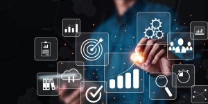 Businessman or Analyst working with Business Analytics and Data Management System on virtual screen,Corporate strategy for finance, operations, sales, marketing.