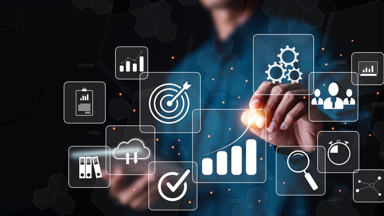 Businessman or Analyst working with Business Analytics and Data Management System on virtual screen,Corporate strategy for finance, operations, sales, marketing.