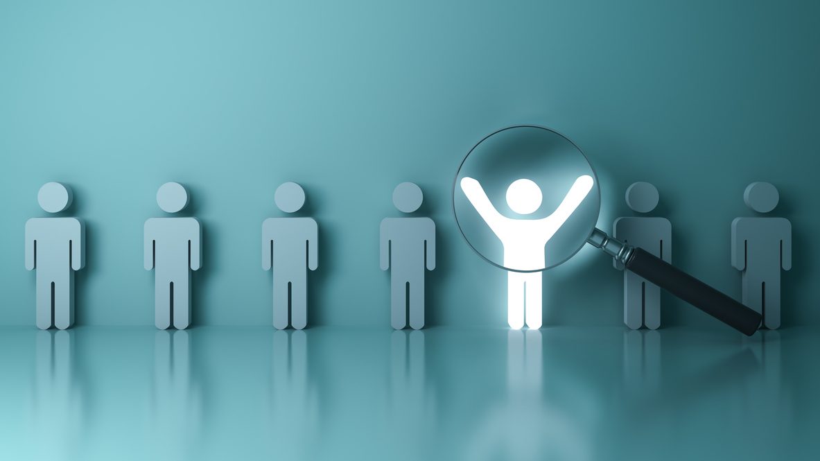 Searching for the right person concept, Stand out from the crowd and different concept , Magnifying glass focusing on the light man standing with arms wide open on green wall background. 3D rendering.