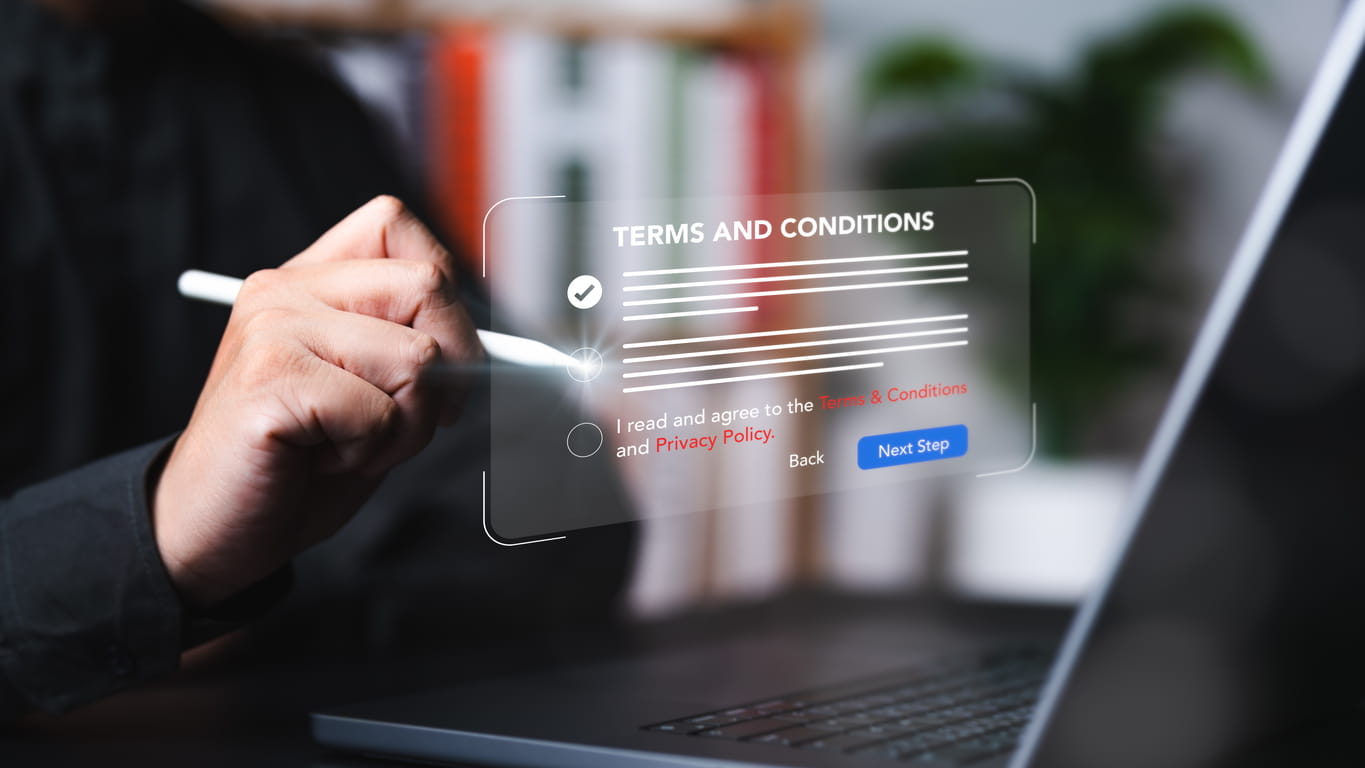 Businessman using stylus to check boxes on digital terms and conditions document on virtual screen.