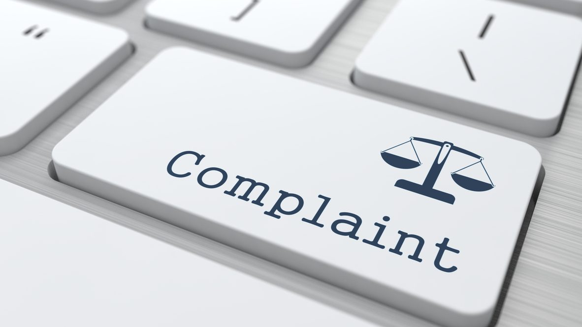 White Button with Complaint on Computer Keyboard. Business Concept.