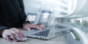 Concept of Online education. man use Online education training and e-learning webinar on internet for personal development and professional qualifications. Digital courses to develop new skills.