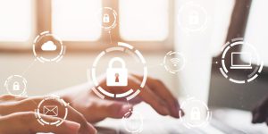 Businessman working on laptop. Protection network security computer and safe your data concept. Digital crime by an anonymous hacker