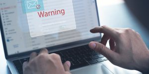 Blocking spam e-mail, warning pop-up for phishing mail, network security concept