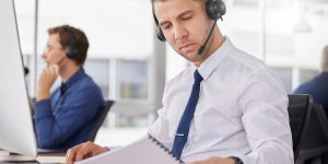 Call center, business man and corporate paperwork of a telemarketing employee with a document