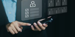 Close-up of a person using a smartphone with digital icons, symbolizing online management and personal data organization