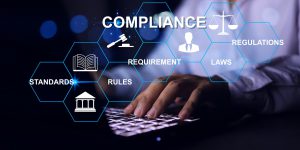 Compliance concept with businessman working with laptop to apply requirement for standard regulation